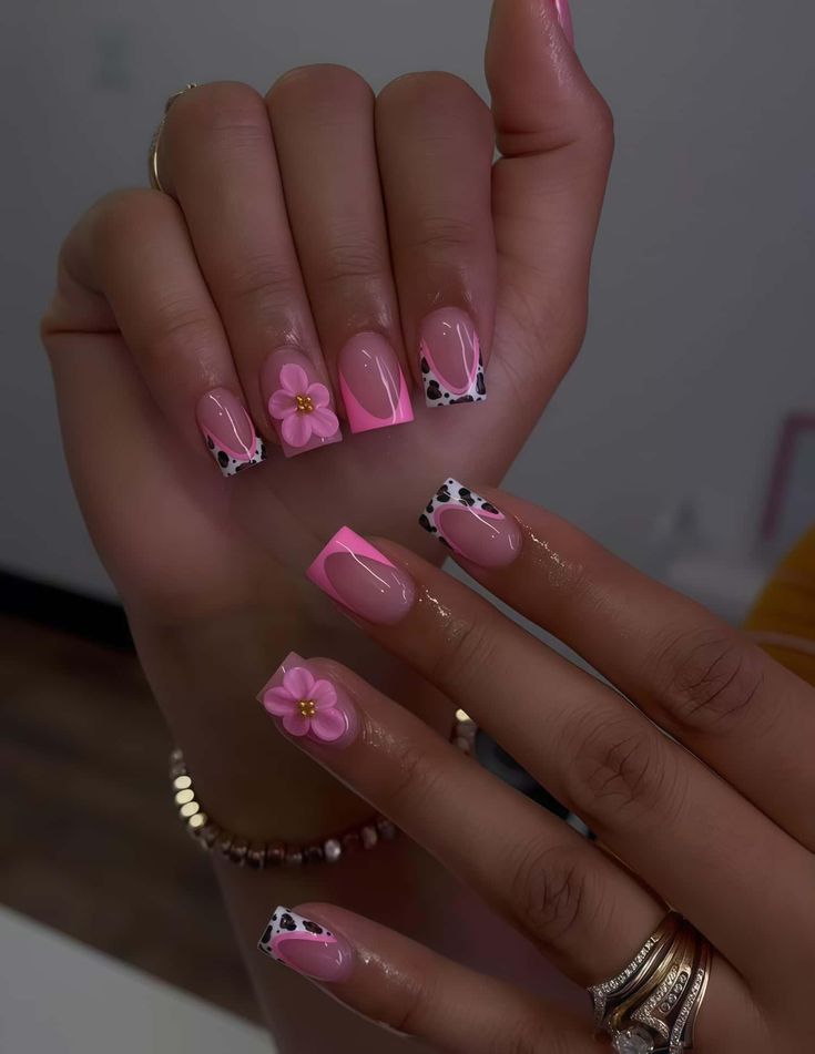 Square nails with pink French tips, animal-print accents and 3D flowers