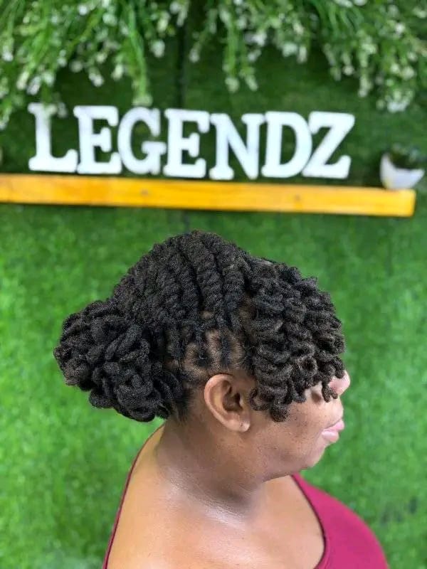 Twisted sides leading into a curled loc updo